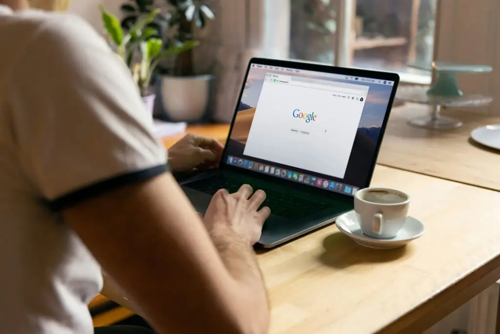 Image of someone using a laptop on a google search landing page