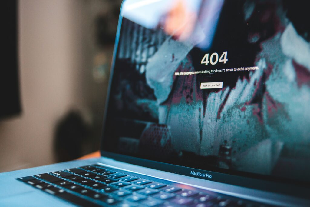 laptop screen with a 404 error code showing content is missing