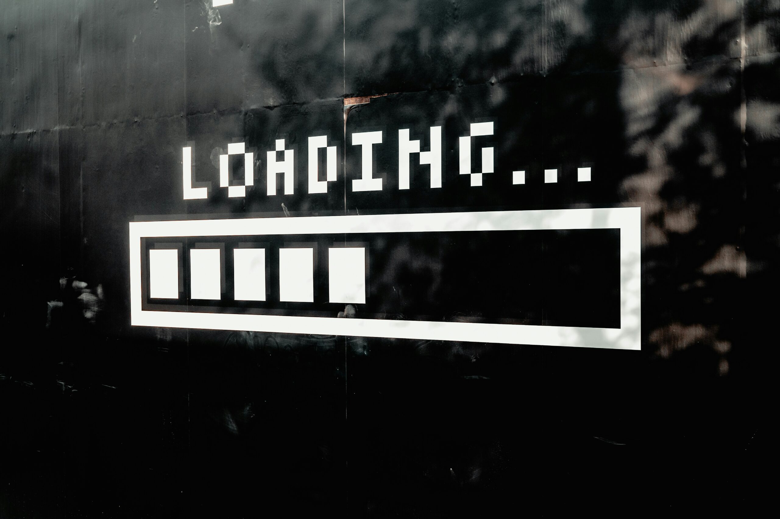 Loading bar on a wall representing slow loading times on a website
